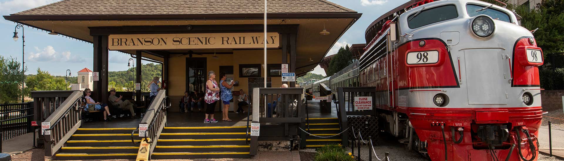 Branson Scenic Railway station with train parked alongside it in Historic Downtown Branson.