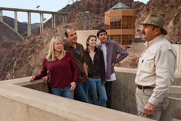 Pink Jeep tour guide and guests at Hoover Dam