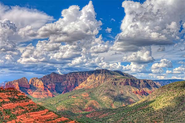 Panoramic view of Sedona rock formations from Schnebly Hill Road in late afternoon.